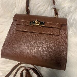 Brown hand bag with cross body strap